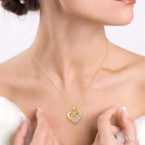 1/10 Ctw Round Cut Diamond Heart Shape Journey Pendant in 10K Yellow Gold with Chain