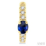 1/10 ctw Petite 4X3 MM Oval Cut Sapphire and Round Cut Diamond Fashion Huggies in 10K Yellow Gold