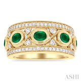 4X3MM Oval and 2.8MM Round Cut Emerald and 3/8 ctw Curvy Crisscross Single Cut Diamond Precious Band in 14K Yellow Gold