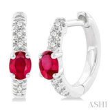 1/10 ctw Petite 4X3 MM Oval Cut Ruby and Round Cut Diamond Fashion Huggies in 10K White Gold