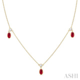 1/4 ctw Round Cut Diamonds and 5X3MM Oval Shape Ruby Precious Station Necklace in 14K Yellow Gold